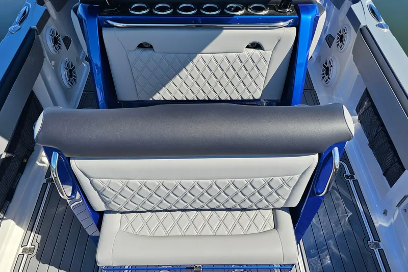Slide: The Image of 2025 Nor-Tech 390 Sport Center Console interior with diamond-stitched seating and modern design. - 17