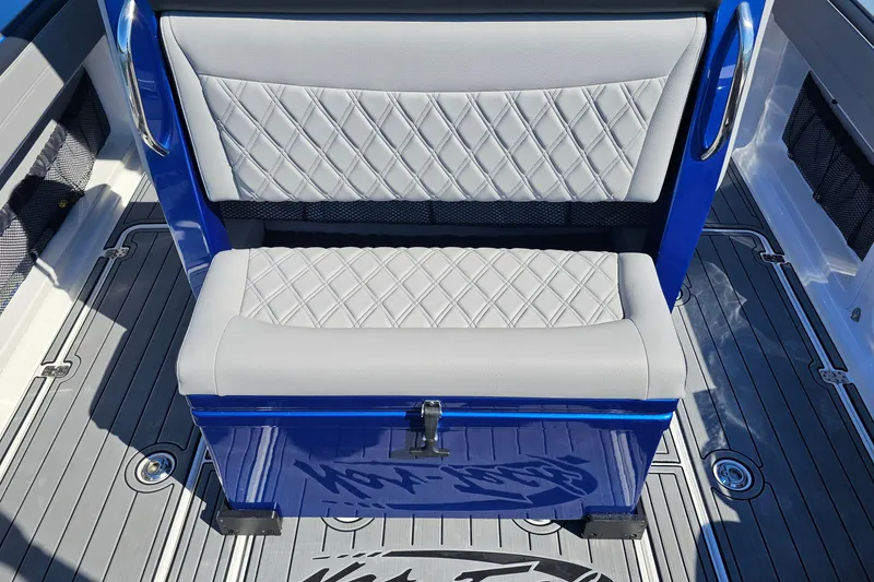 Slide: The Image of 2025 Nor-Tech 390 Sport Center Console, featuring diamond-stitched seating and sleek blue accents. - 19
