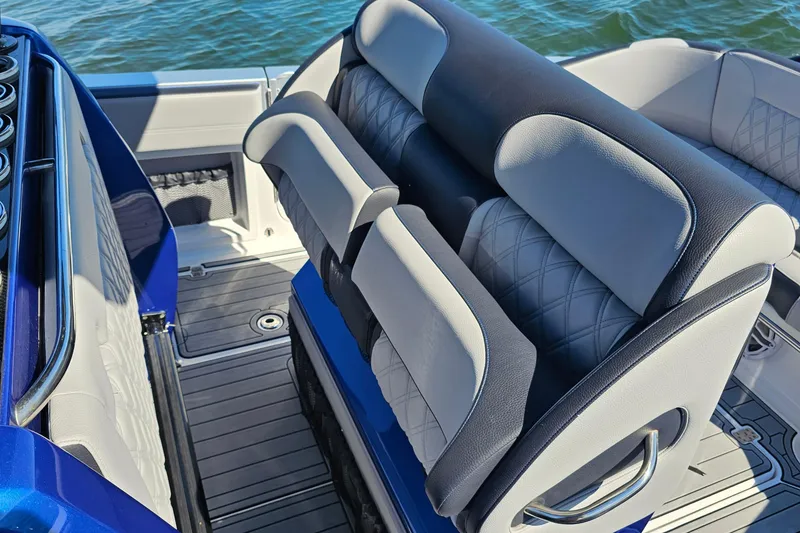 Slide: The Image of 2025 Nor-Tech 390 Sport Center Console boat interior with luxurious seating and sleek design. - 22