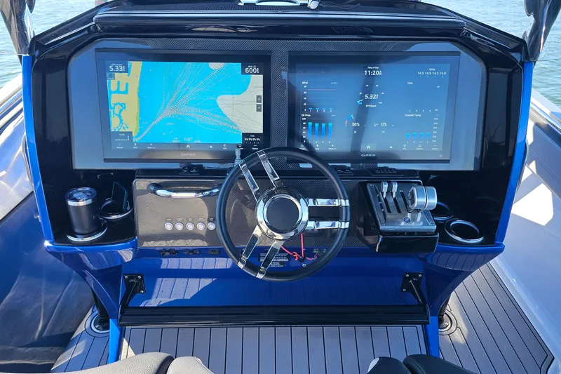 Slide: The Image of 2025 Nor-Tech 390 Sport Center Console dashboard with advanced navigation and control systems. - 26