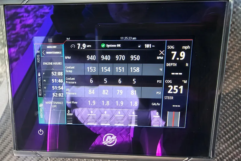 Slide: The Image of Display screen of 2025 Nor-Tech 390 Sport Center Console showing engine metrics and system status. - 31