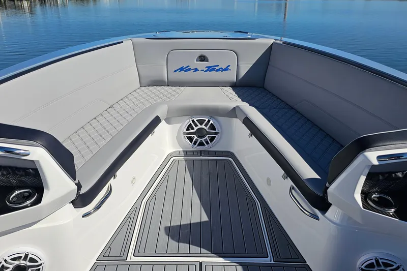 Slide: The Image of 2025 Nor-Tech 390 Sport Center Console interior with sleek seating and modern design. - 38