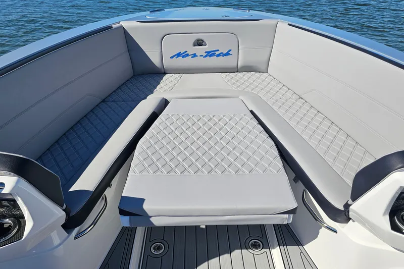 Slide: The Image of 2025 Nor-Tech 390 Sport Center Console boat interior with cushioned seating and elegant design. - 41