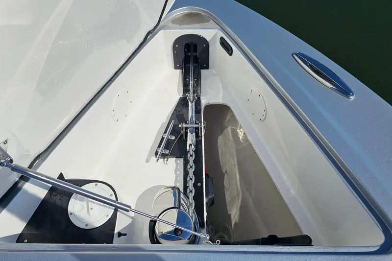Slide: The Image of 2025 Nor-Tech 390 Sport Center Console anchor compartment with chain and winch system. - 42