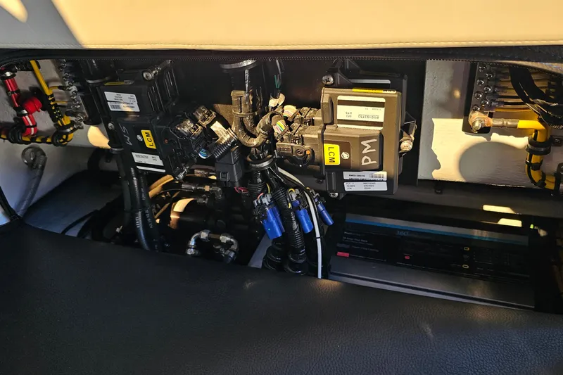 Slide: The Image of Electrical components inside a 2025 Nor-Tech 390 Sport Center Console boat. - 47