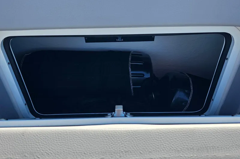 Slide: The Image of Storage compartment in 2025 Nor-Tech 390 Sport Center Console boat. - 49