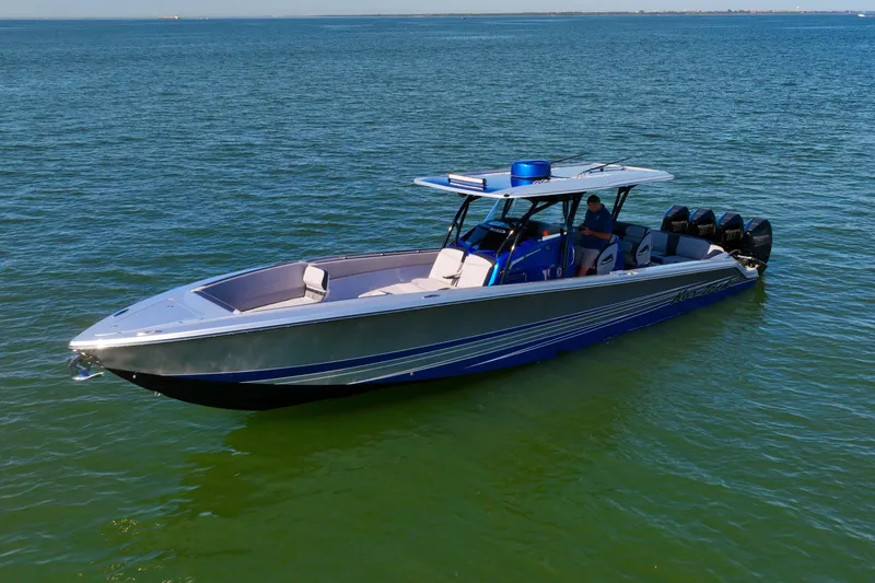 Slide: The Image of 2025 Nor-Tech 390 Sport Center Console boat on calm water. - 9