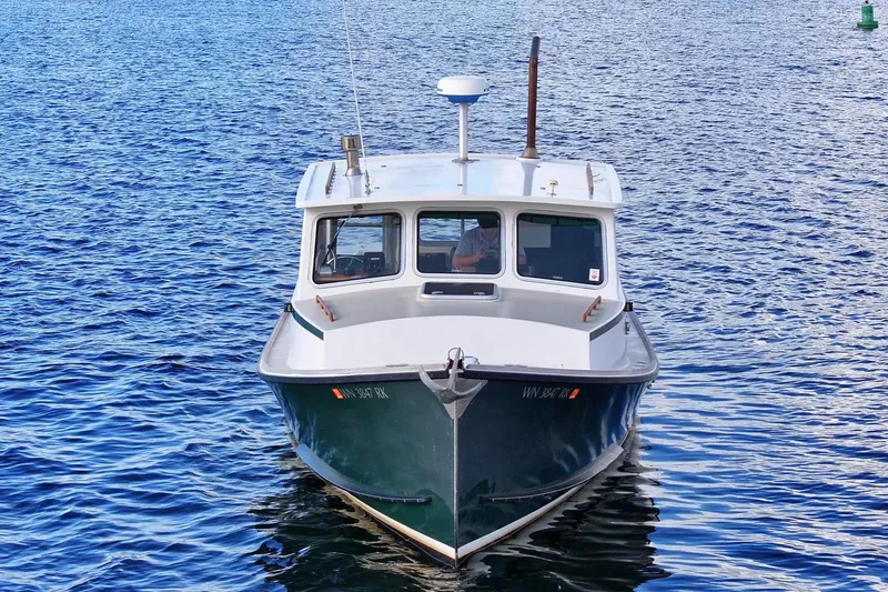 Slide: The Image of 1984 Martin Yachts Lobster Boat on calm blue water. - 10