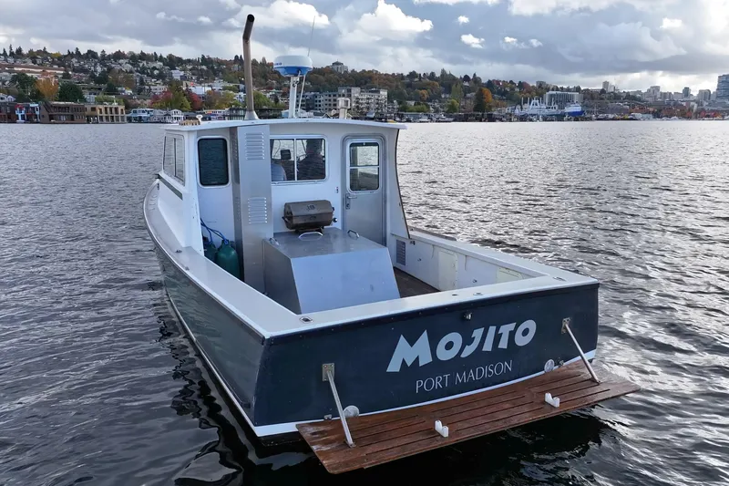 Slide: The Image of 1984 Martin Yachts Lobster Boat "Mojito" on water near Port Madison, scenic background. - 14