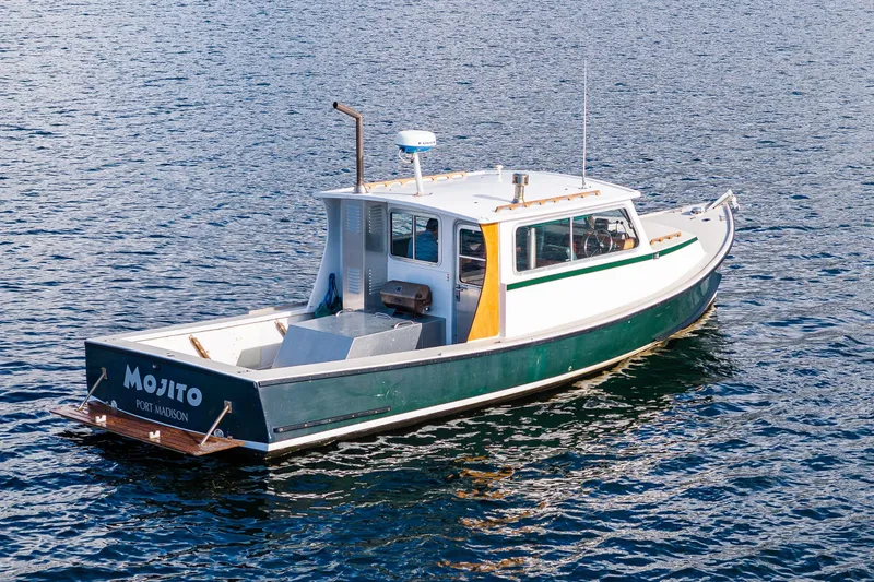 Slide: The Image of 1984 Martin Yachts Lobster Boat on water, named "Mojito," Port Madison. - 29