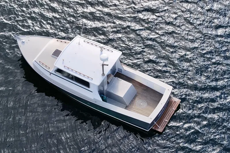 Slide: The Image of 1984 Martin Yachts Lobster Boat on water, aerial view, sleek design, classic maritime vessel. - 3