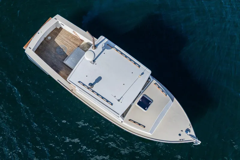 Slide: The Image of Overhead view of 1984 Martin Yachts Lobster Boat on blue water. - 7