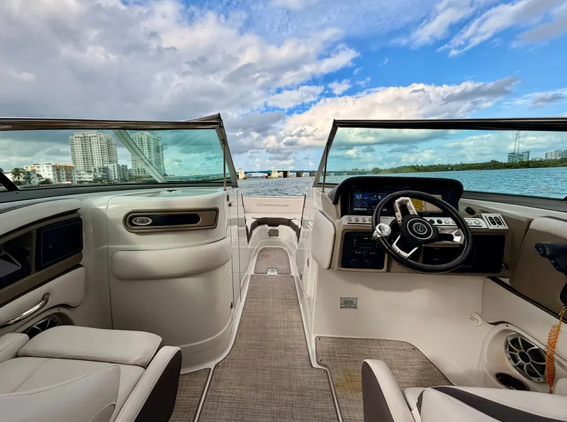 Slide: The Image of Interior of 2023 Crownline 285 XS yacht with water view. - 7