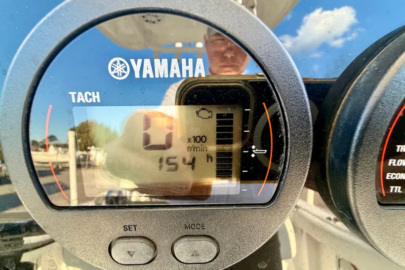 Slide: The Image of Yamaha tachometer display on 2020 Tidewater 210 LXF boat, showing 154 hours. - 10
