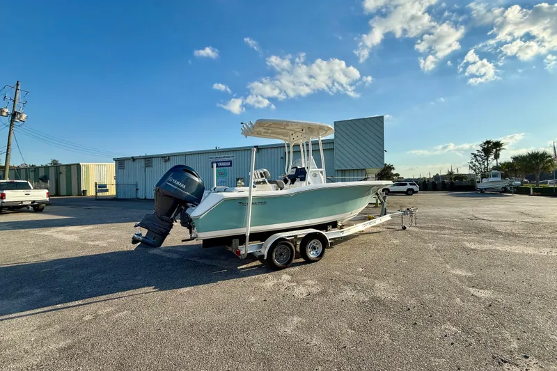 Slide: The Image of 2020 Tidewater 210 LXF boat on trailer in sunny parking lot. - 3