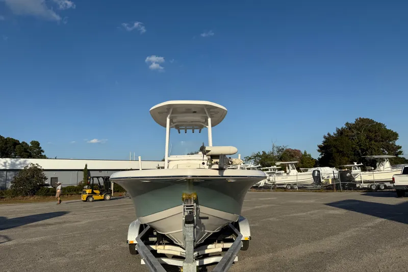 Slide: The Image of 2020 Tidewater 210 LXF boat on trailer under clear blue sky. - 4