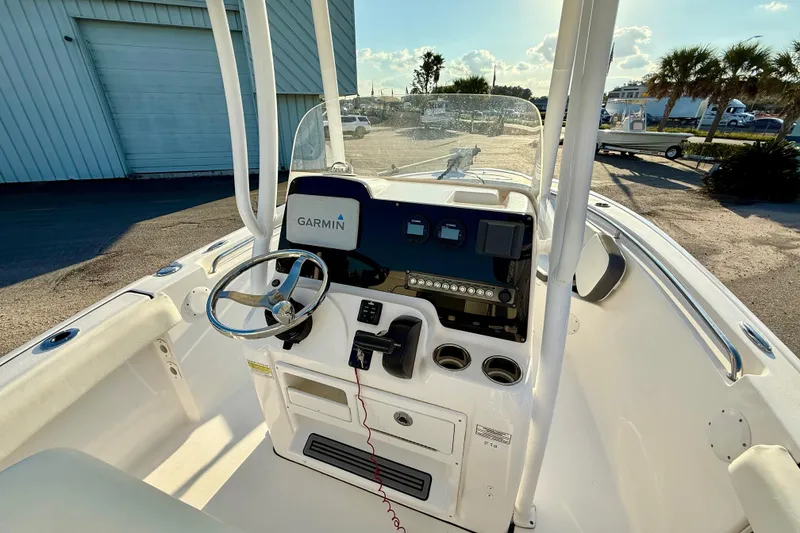 Slide: The Image of 2020 Tidewater 210 LXF boat interior with Garmin navigation system and steering wheel. - 5