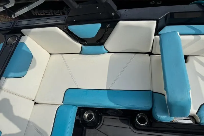 Slide: The Image of 2021 Heyday WTSurf boat interior with blue and white seating. - 5