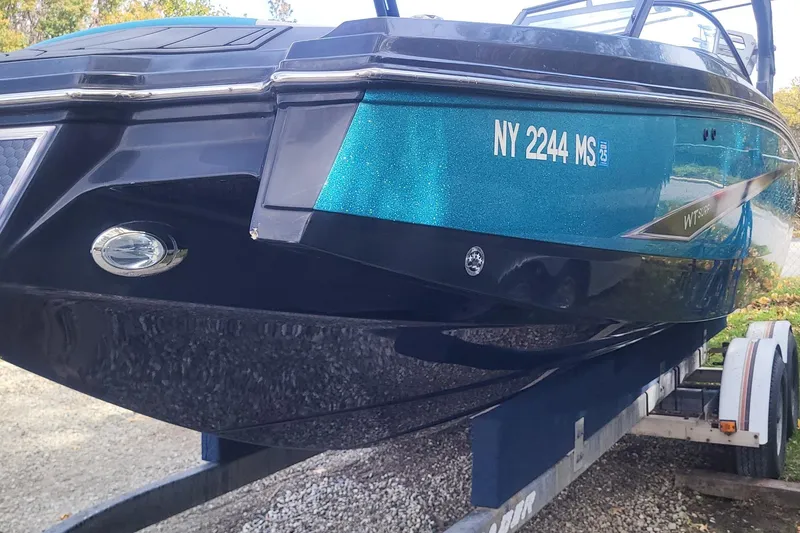 Slide: The Image of 2021 Heyday WTSurf boat on trailer, blue and black exterior, registration NY 2244 MS. - 17