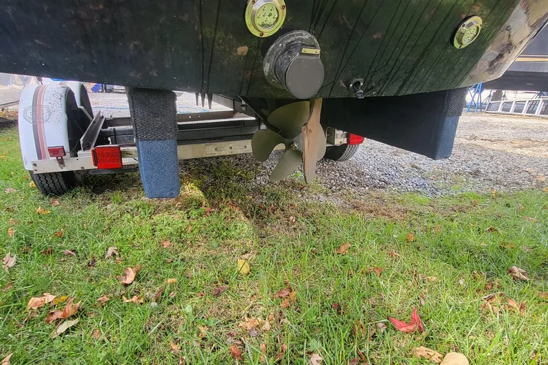 Slide: The Image of 2021 Heyday WTSurf boat on trailer, showing propeller and hull details. - 18