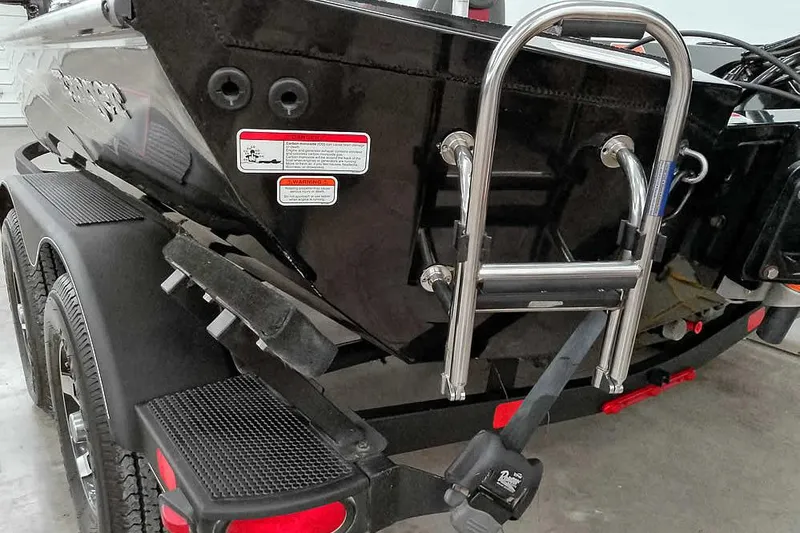 Slide: The Image of 2023 Ranger RT198P boat trailer with ladder and safety warnings. - 15