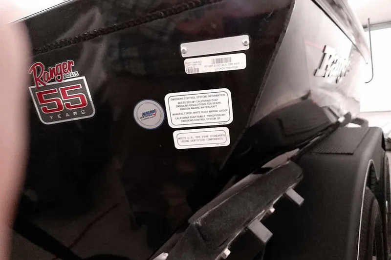 Slide: The Image of 2023 Ranger RT198P boat with 55th anniversary logo and emission control labels. - 16