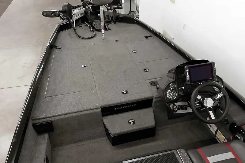 Slide: The Image of 2023 Ranger RT198P boat interior with steering console and fishing deck. - 17