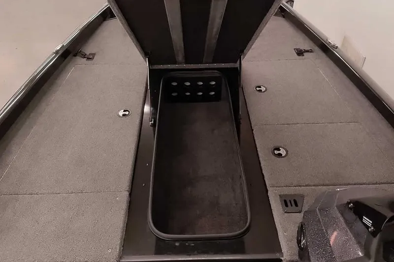 Slide: The Image of 2023 Ranger RT198P boat interior with open storage compartment and carpeted deck. - 19