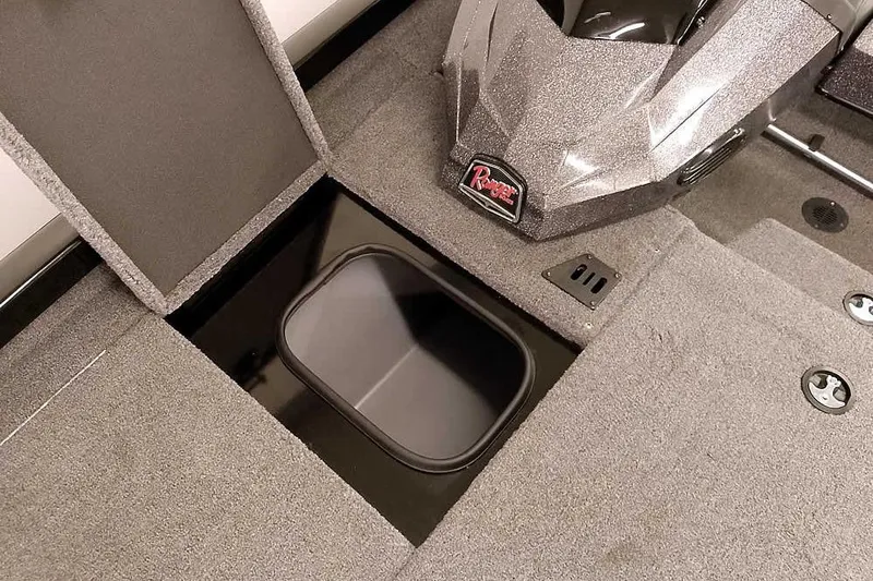 Slide: The Image of 2023 Ranger RT198P boat interior with open storage compartment and carpeted flooring. - 20