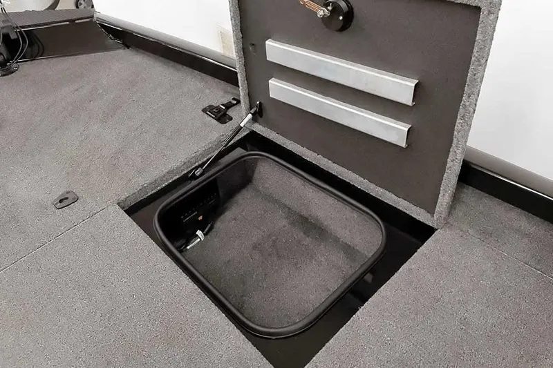Slide: The Image of 2023 Ranger RT198P boat storage compartment with open hatch, showcasing interior details. - 21
