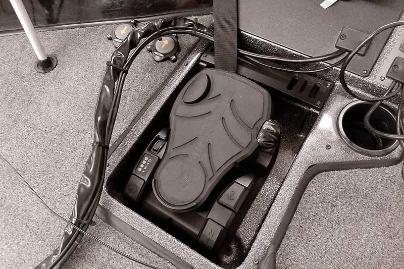 Slide: The Image of 2023 Ranger RT198P boat foot pedal and control panel on carpeted deck. - 27