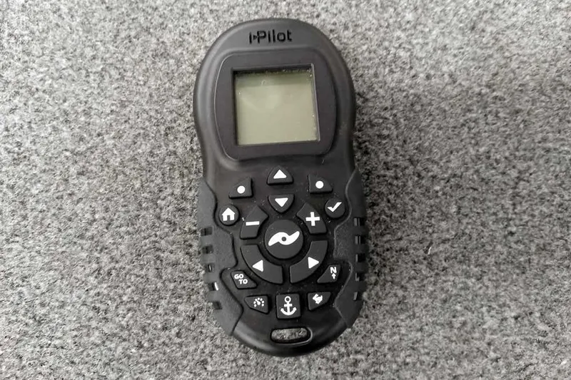 Slide: The Image of Remote control for iPilot system on a 2023 Ranger RT198P boat. - 28