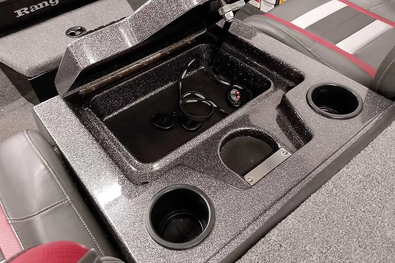 Slide: The Image of 2023 Ranger RT198P boat interior with storage compartment and cup holders. - 30