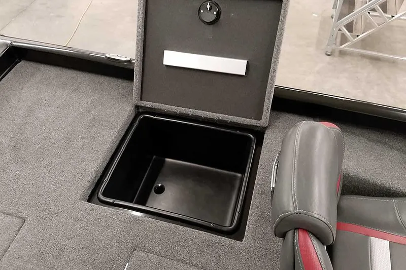 Slide: The Image of 2023 Ranger RT198P boat storage compartment with open lid and cushioned seat. - 37