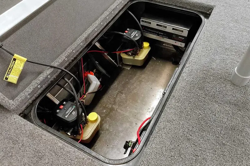 Slide: The Image of 2023 Ranger RT198P boat battery compartment with wiring and components. - 39