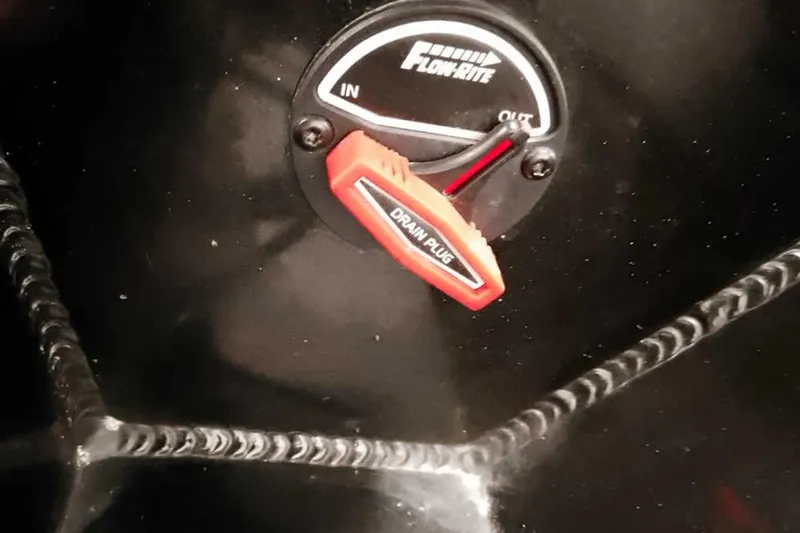 Slide: The Image of 2023 Ranger RT198P Flow-Rite drain plug control with red handle. - 41