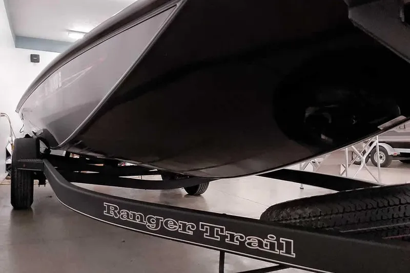Slide: The Image of 2023 Ranger RT198P boat on Ranger Trail trailer in garage setting. - 6