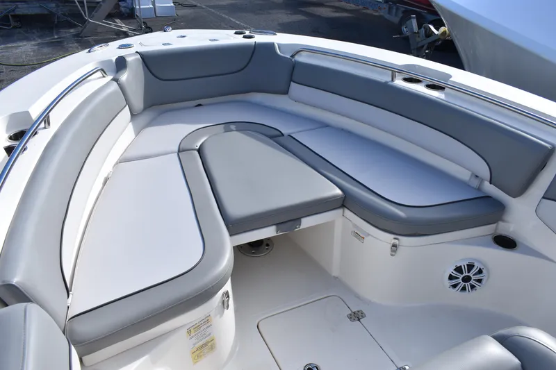 Slide: The Image of 2022 NauticStar 2602 Legacy boat interior with logo and seating detail. - 11