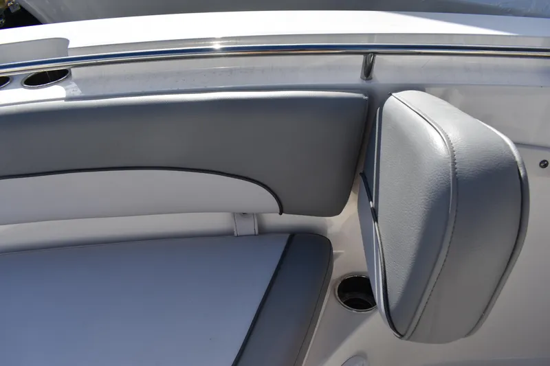 Slide: The Image of Interior view of 2022 NauticStar 2602 Legacy boat's helm with electronic controls. - 13