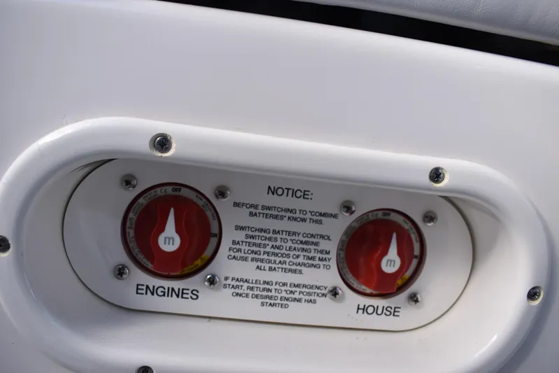 Slide: The Image of 2022 NauticStar 2602 Legacy boat deck with storage compartment and seating. - 25