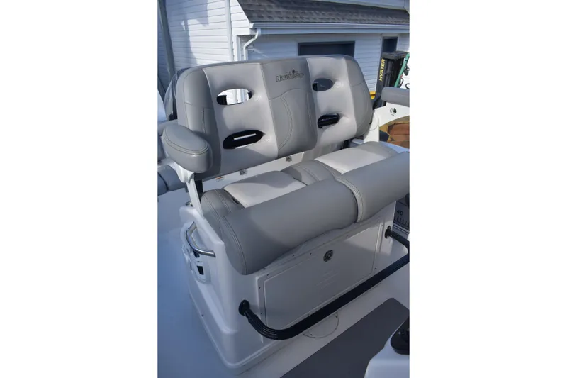 Slide: The Image of Gray cushioned seats on 2022 NauticStar 2602 Legacy boat, featuring sleek design and comfort. - 27
