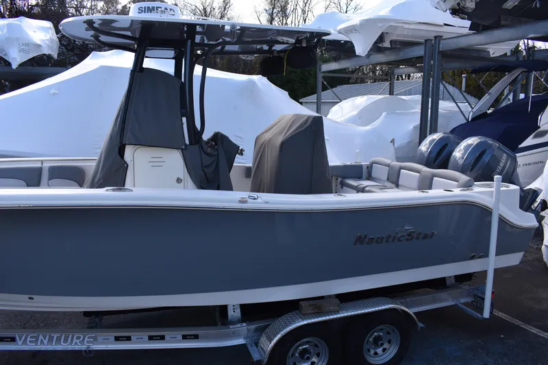 Slide: The Image of NauticStar 2602 Legacy 2022 boat logo on sleek gray surface. - 3