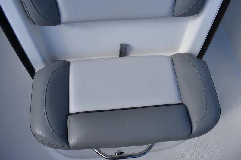 Slide: The Image of 2022 NauticStar 2602 Legacy boat on trailer, covered and parked outdoors. - 9