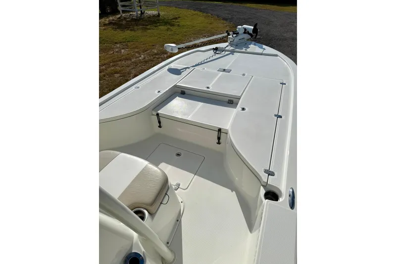 Slide: The Image of 2017 Sea Born FX24 Bay boat interior with seating and storage compartments. - 10