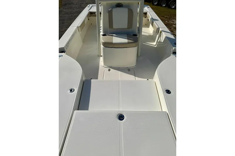 Slide: The Image of 2017 Sea Born FX24 Bay boat interior, featuring spacious deck and seating area. - 15