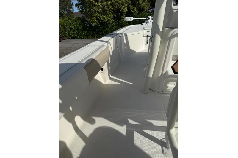 Slide: The Image of 2017 Sea Born FX24 Bay boat interior with white seating and console. - 21
