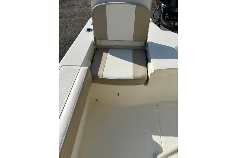 Slide: The Image of 2017 Sea Born FX24 Bay boat interior with beige and white seating. - 23