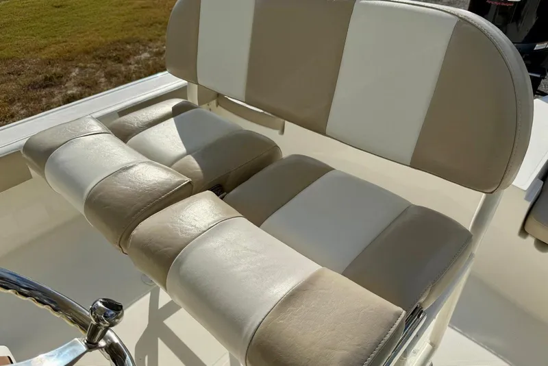 Slide: The Image of 2017 Sea Born FX24 Bay boat seat with beige and white upholstery. - 24