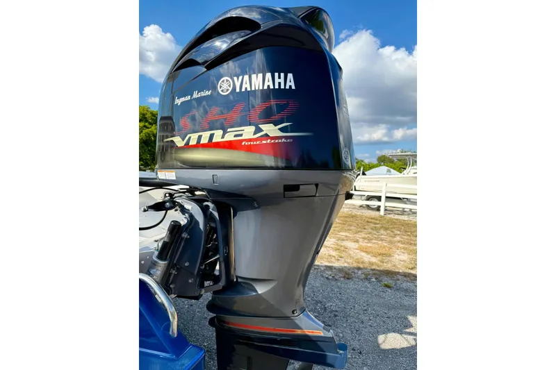 Slide: The Image of Yamaha VMAX outboard motor on 2017 Sea Born FX24 Bay boat, parked outdoors. - 32