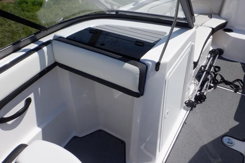 Slide: The Image of 2019 Yamaha Boats SX210 interior with sleek seating and storage compartment. - 24